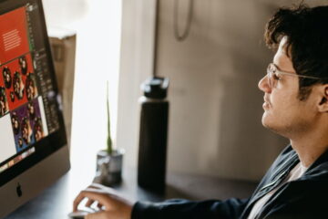 man working on mac computer